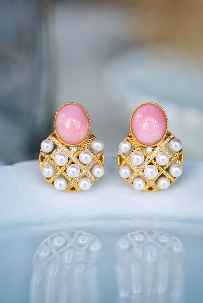 These fairy pink opal earrings exude an ethereal...