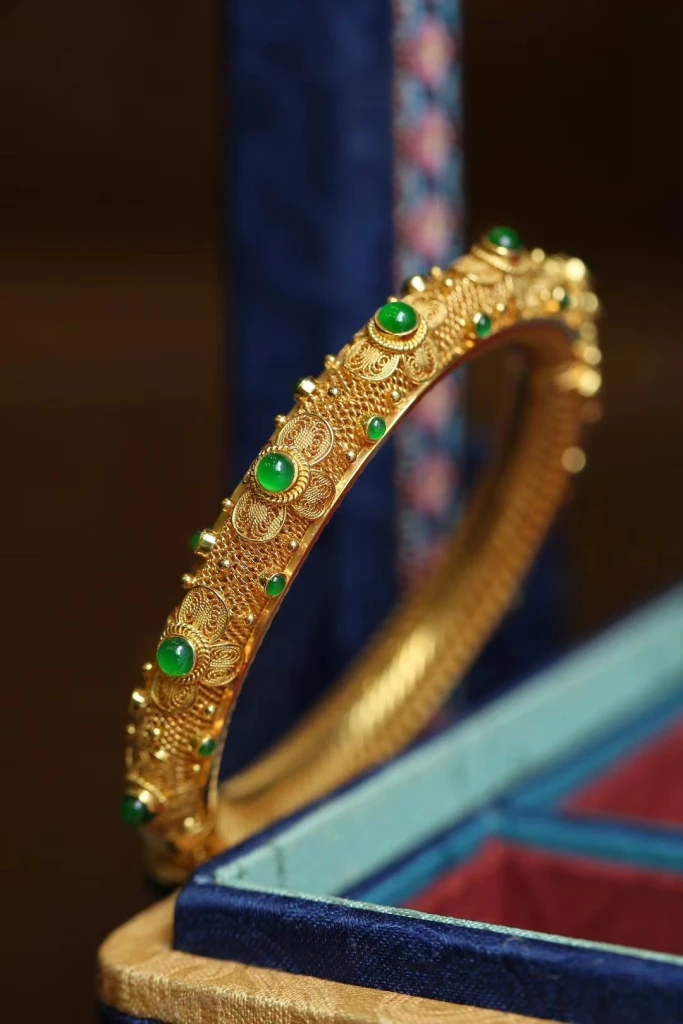 This opulent bracelet, with its intricate filigr...