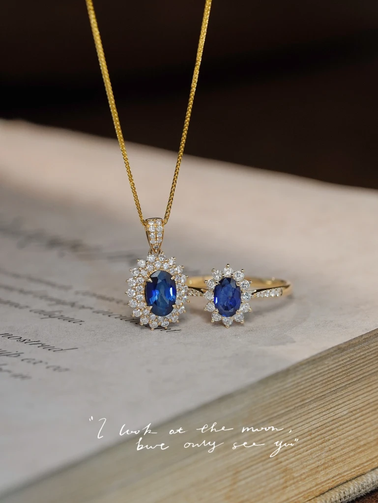 Discover a luxurious 18k gold diamond and sapphi...