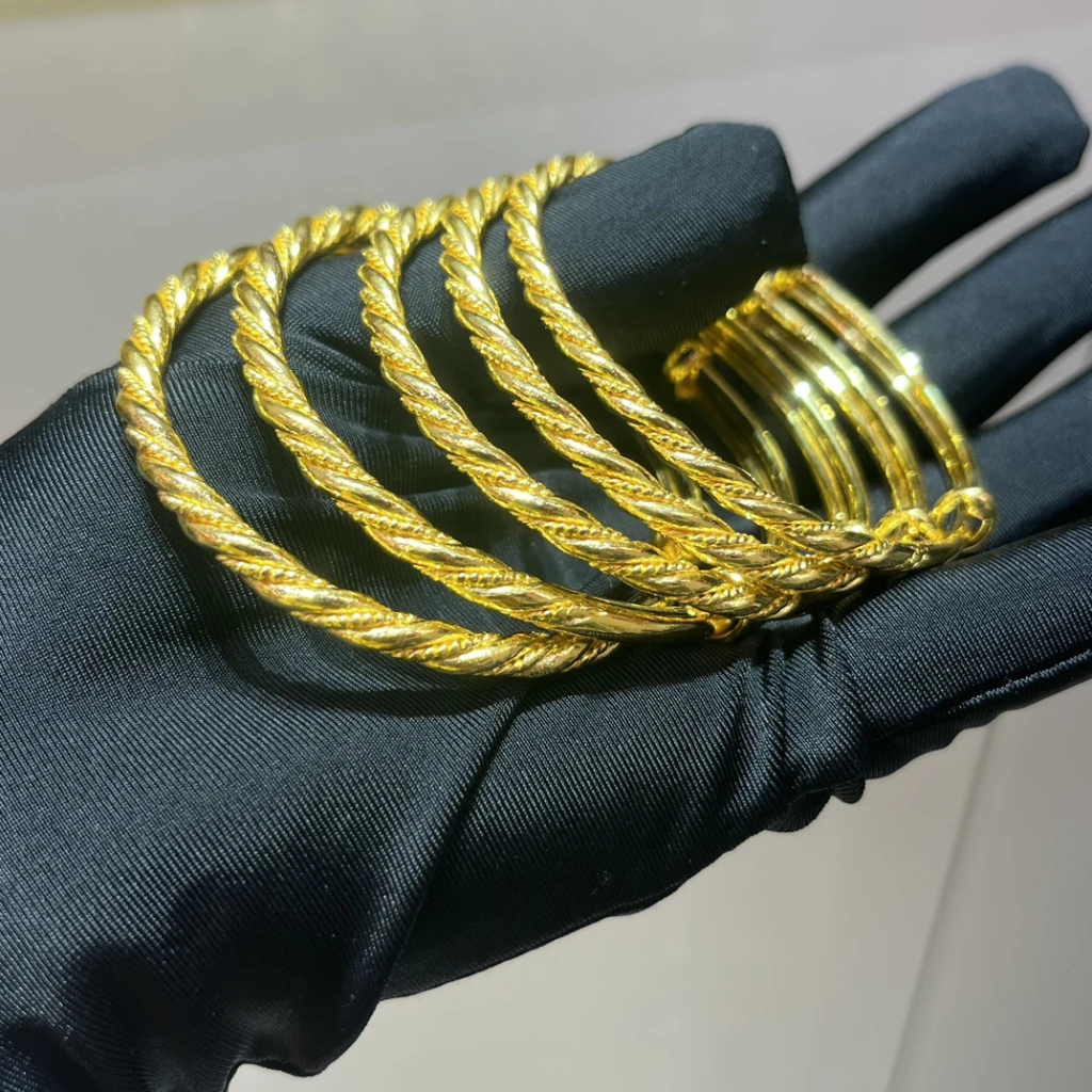 999.9 ren guld smukke fashionable torsade armbån...