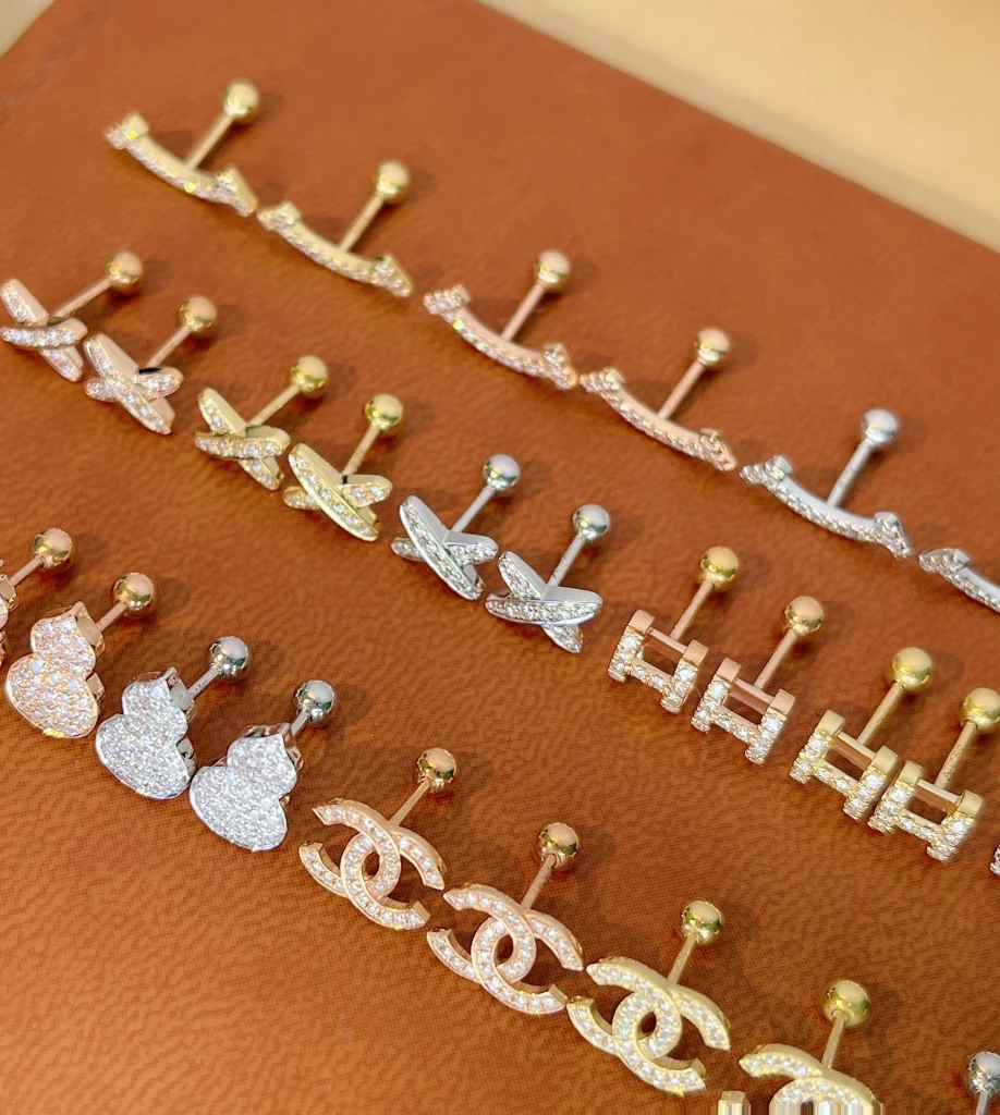 A collection of screw-back earrings that you can...